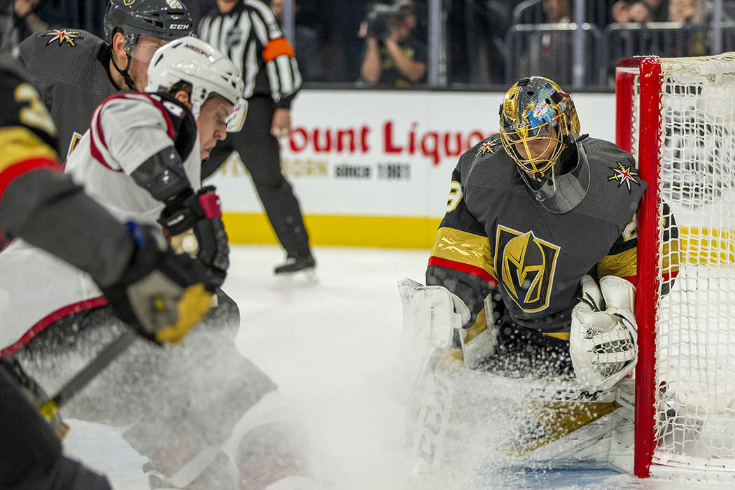 Vegas Golden Knights goaltender Marc-Andre Fleury (29, right) makes another save over the Arizo ...