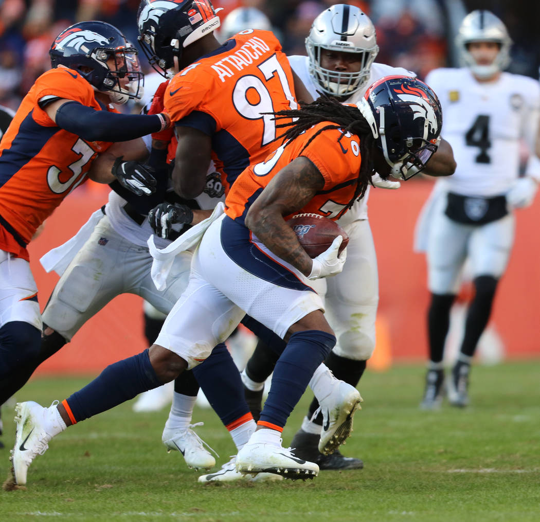 Denver Broncos defensive back Trey Marshall (36) runs after recovering a fumble by Oakland Raid ...