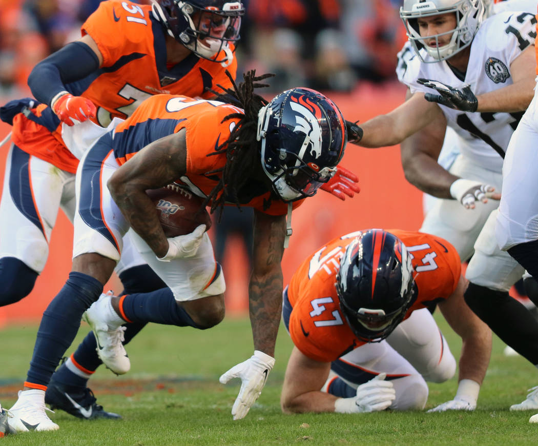 Denver Broncos defensive back Trey Marshall (36) recovers a fumble made by Oakland Raiders wide ...