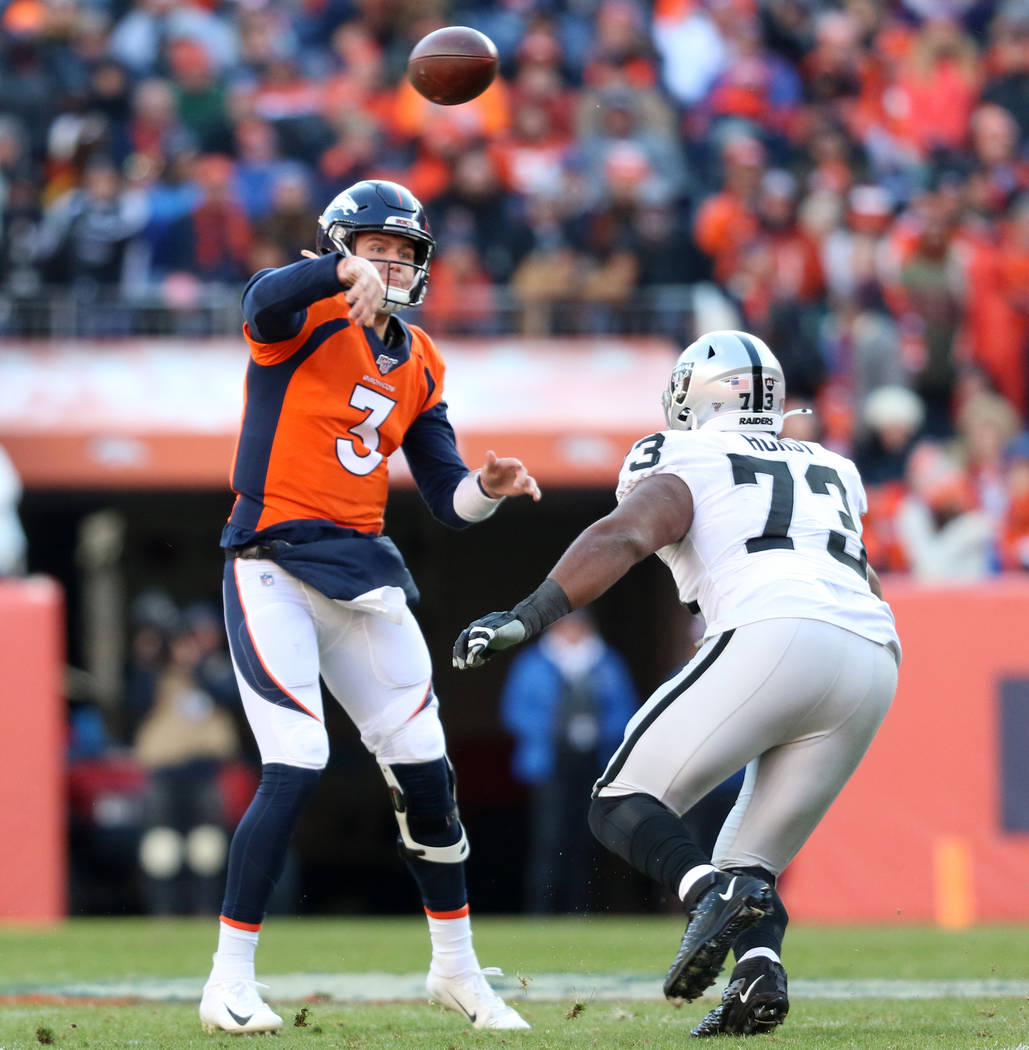 Denver Broncos quarterback Drew Lock (3) throws the football as Oakland Raiders defensive tackl ...