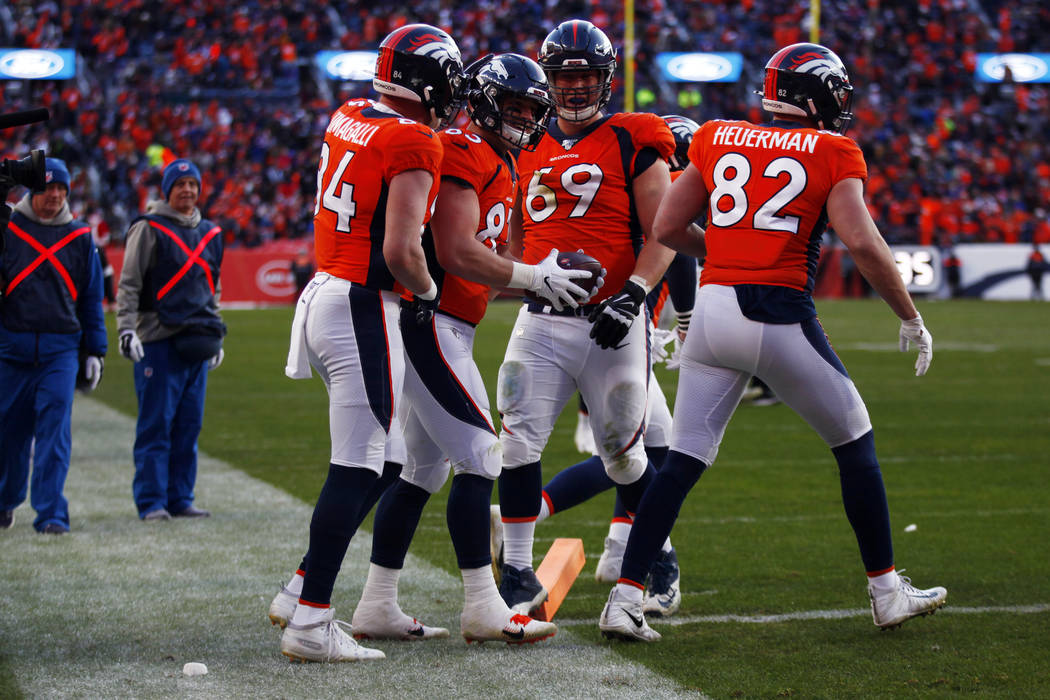 Denver Broncos fullback Andrew Beck (83) celebrates his touchdown score with tight end Troy Fum ...