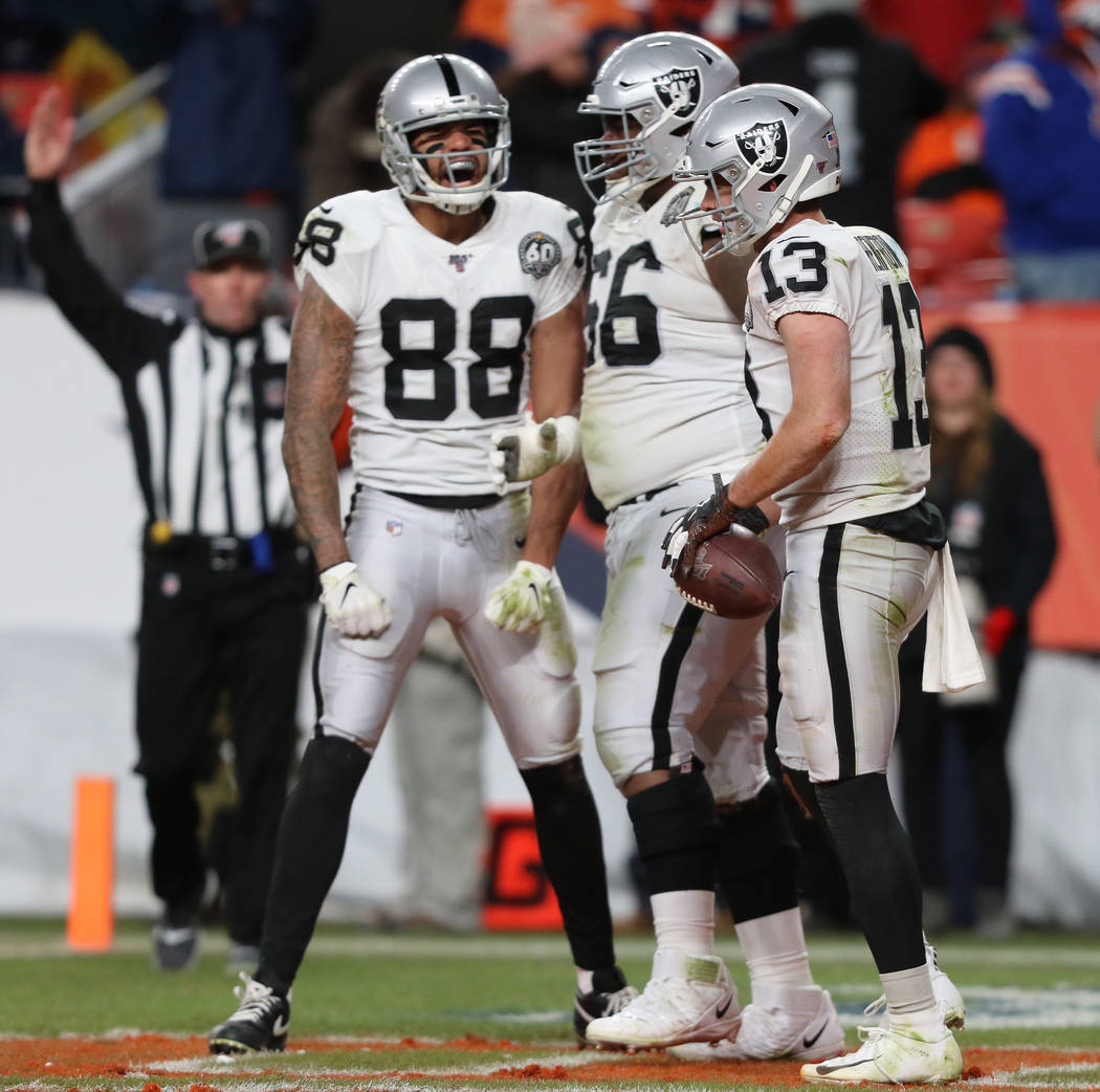 Oakland Raiders wide receiver Hunter Renfrow (13) celebrates his touchdown reception with wide ...