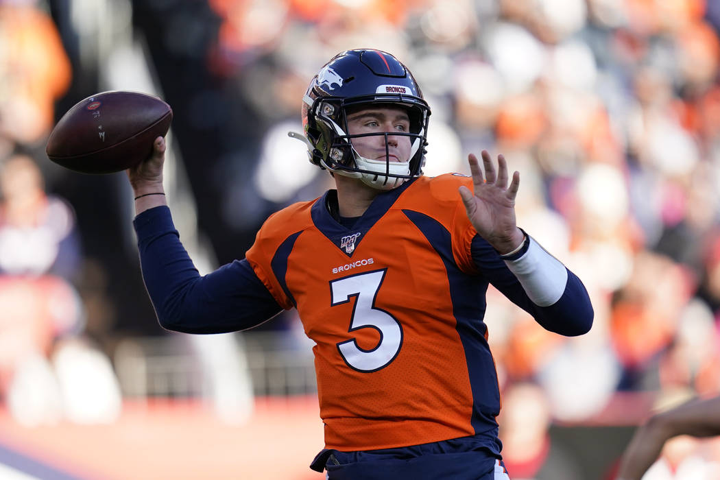 Denver Broncos quarterback Drew Lock throws a pass during the first half of an NFL football gam ...