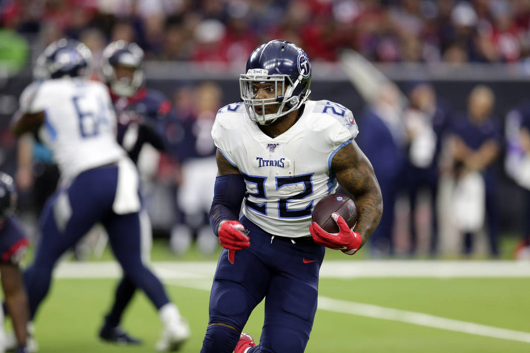 Tennessee Titans running back Derrick Henry (22) rushes against the Houston Texans during the f ...