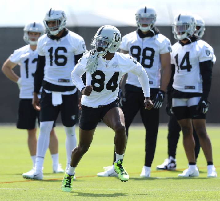 Oakland Raiders wide receiver Antonio Brown (84) runs a route as his teammates, from left, wide ...