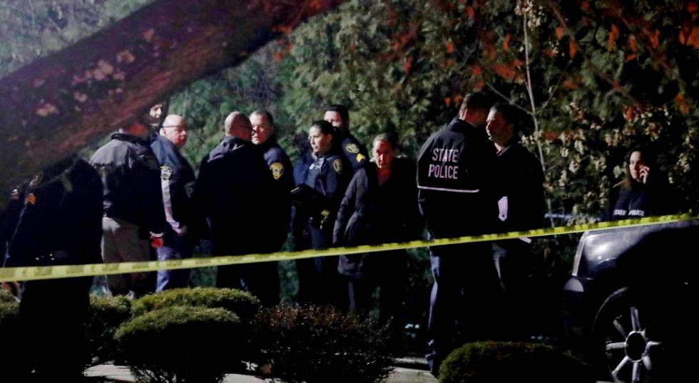 Police gather outside a residence in Monsey, N.Y., early Sunday, Dec. 29, 2019, following a sta ...