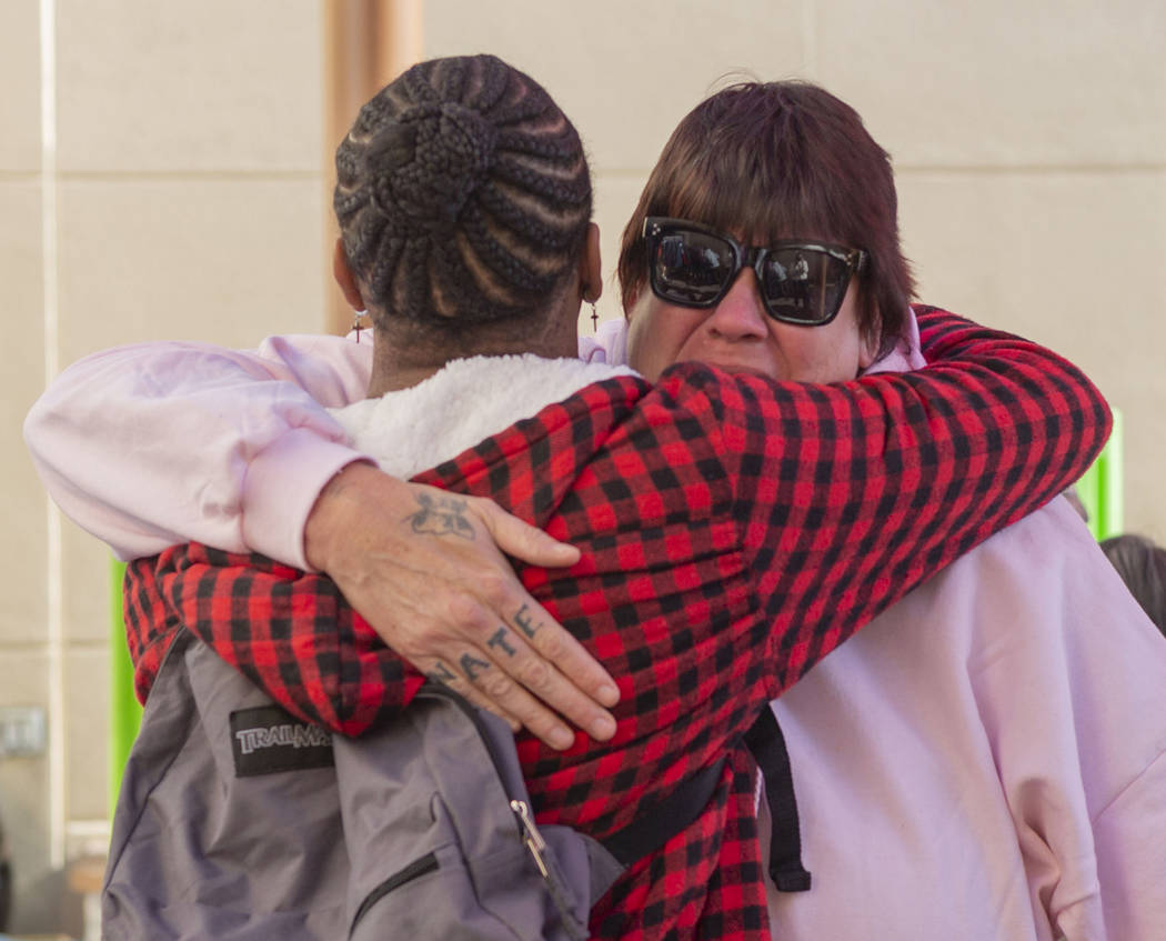 Alpine Motel residents Timothy Henry, left, and a tearful Sandra Jones, comfort one another dur ...