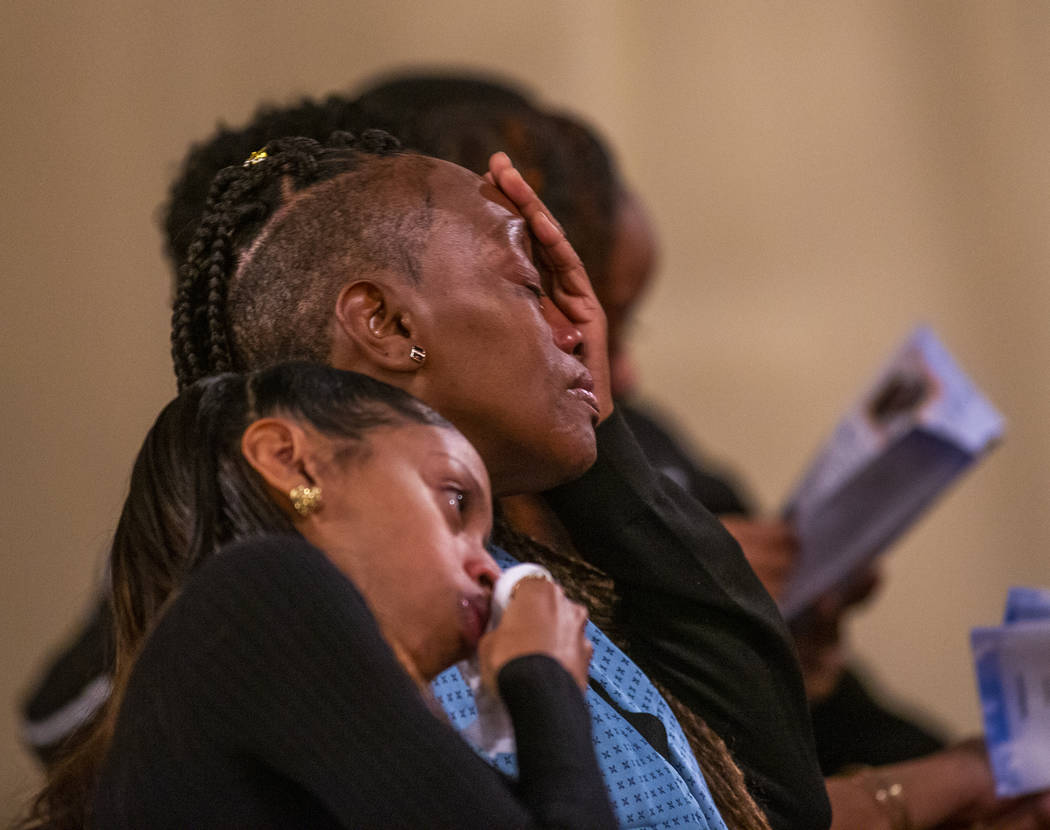 Family members become emotional during a funeral service for Don Bennett, a maintenance man and ...