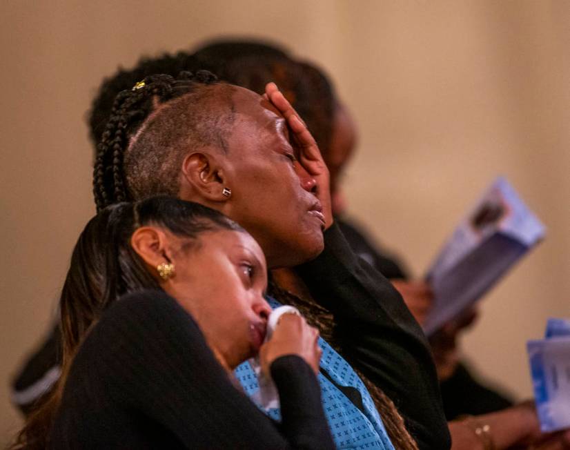 Family members become emotional during a funeral service for Don Bennett, a maintenance man and ...