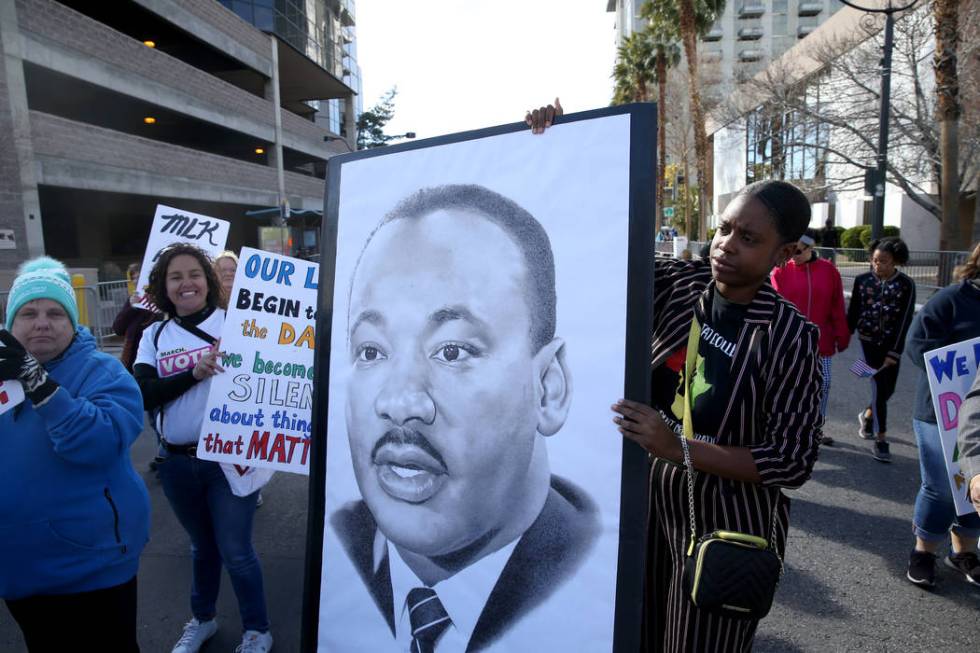 Ashley Bowman, 25, marches with the Clark County Democratic Party entry in the 37th Annual Dr. ...