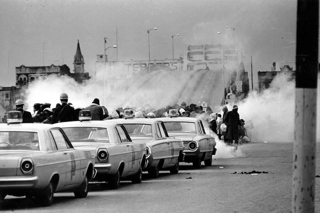 Tear gas fumes fill the air as state troopers, ordered by Gov. George Wallace, break up a demon ...