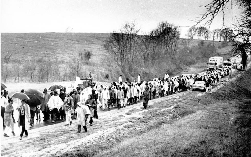 Civil rights marchers reach the halfway mark in their 50-mile protest walk as they trudge along ...