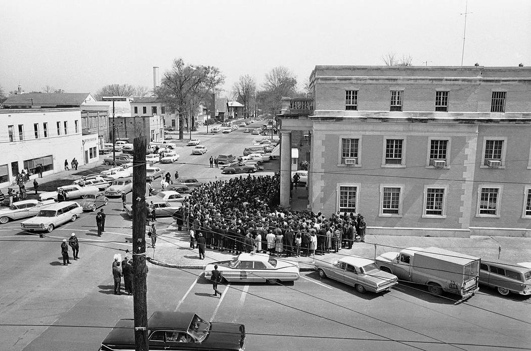 Upward of 500 marchers crowd on the steps and sidewalk in front of Selma, Ala., City Hall and s ...