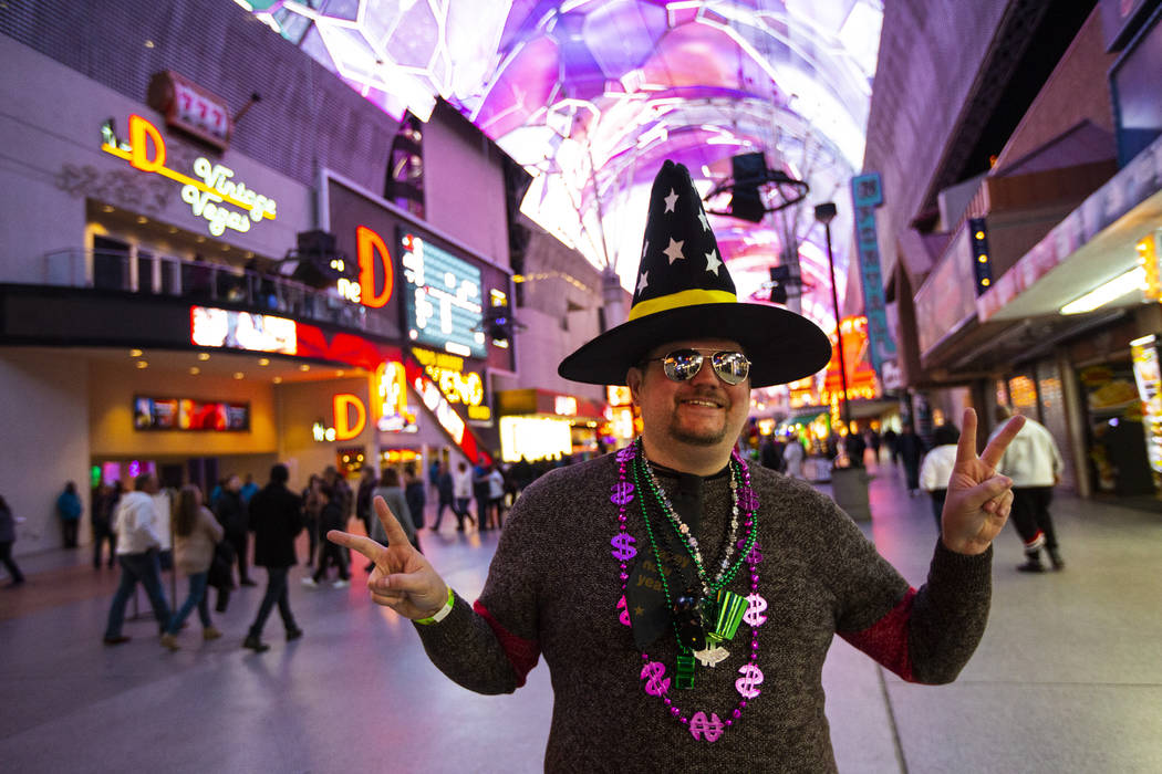 Kerry Kaus of Salem, Ore., poses for a portrait as New Year's Eve revelers gather at the Fremon ...