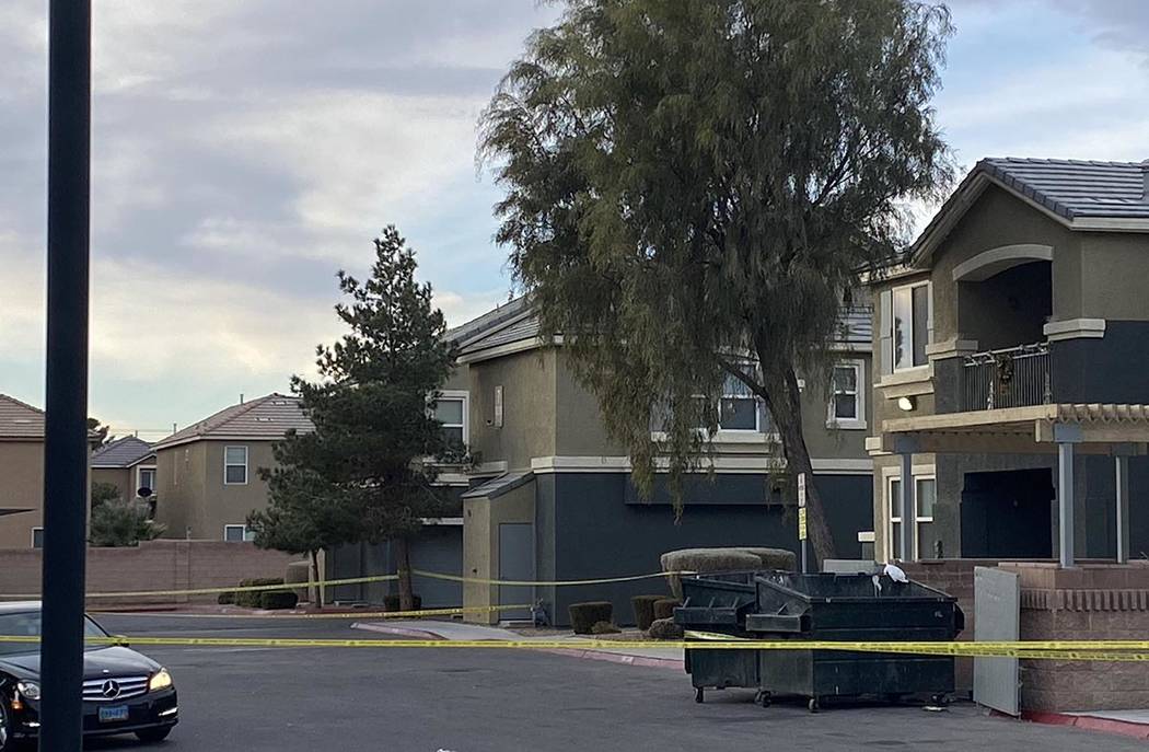 Crime scene tape surrounds Atlas Apartment Homes on Madre Mesa Drive in northwest Las Vegas on ...