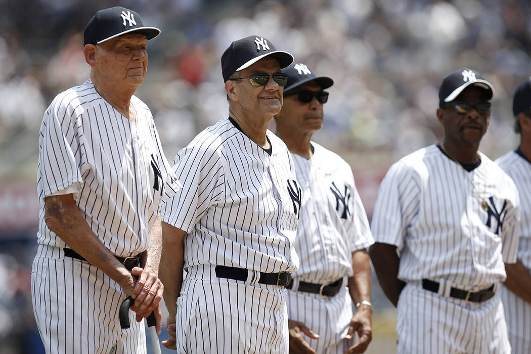 Former New Yankees pitcher Don Larsen, left, stands beside former Yankee manager Joe Torre, Hal ...
