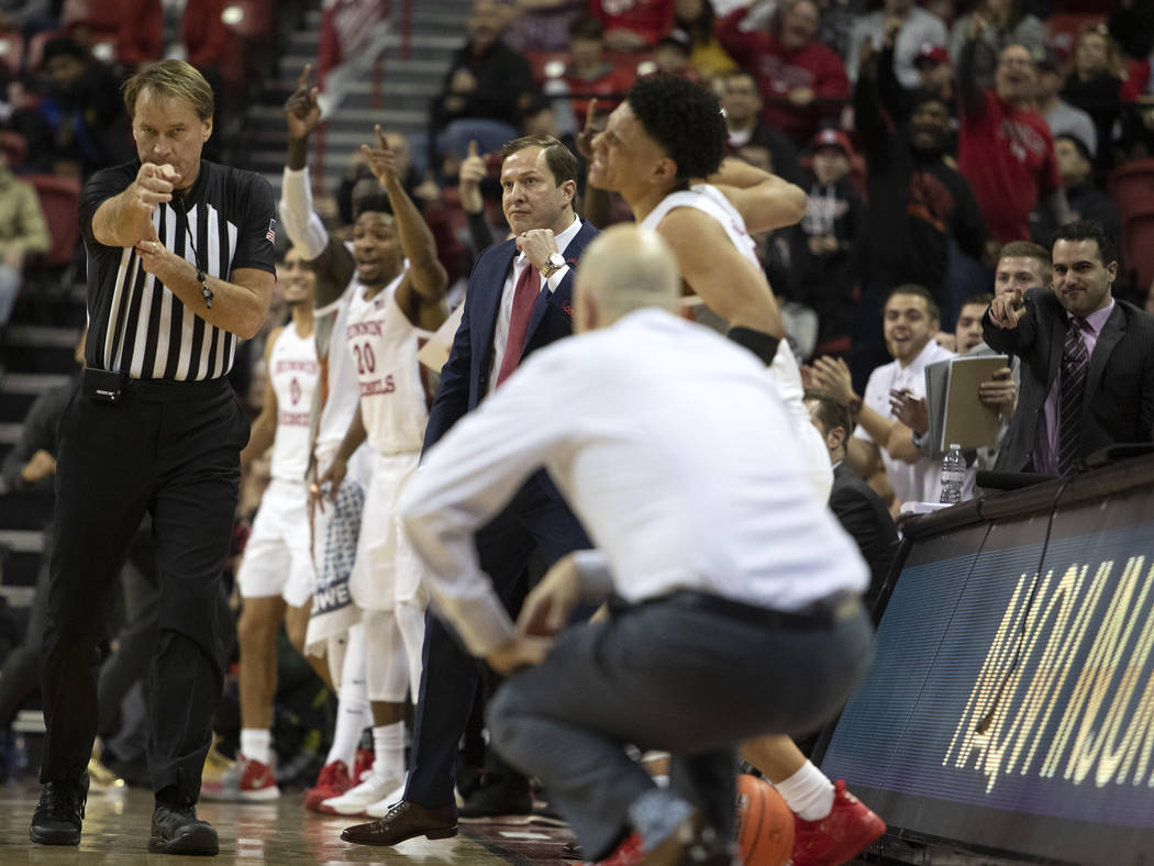 UNLV's basketball team celebrates a call by a referee during the second half of the game agains ...