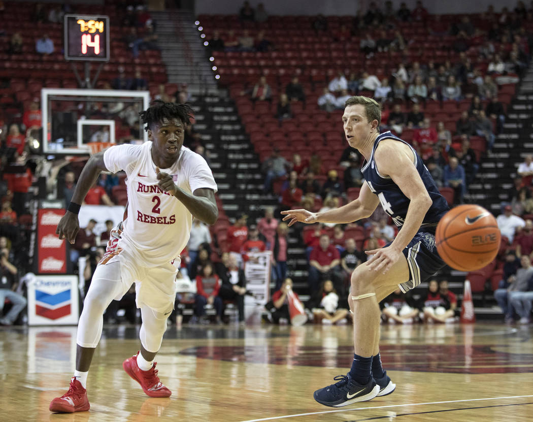 UNLV's forward Donnie Tillman (2) runs after passing the ball as Utah State's forward Justin Be ...