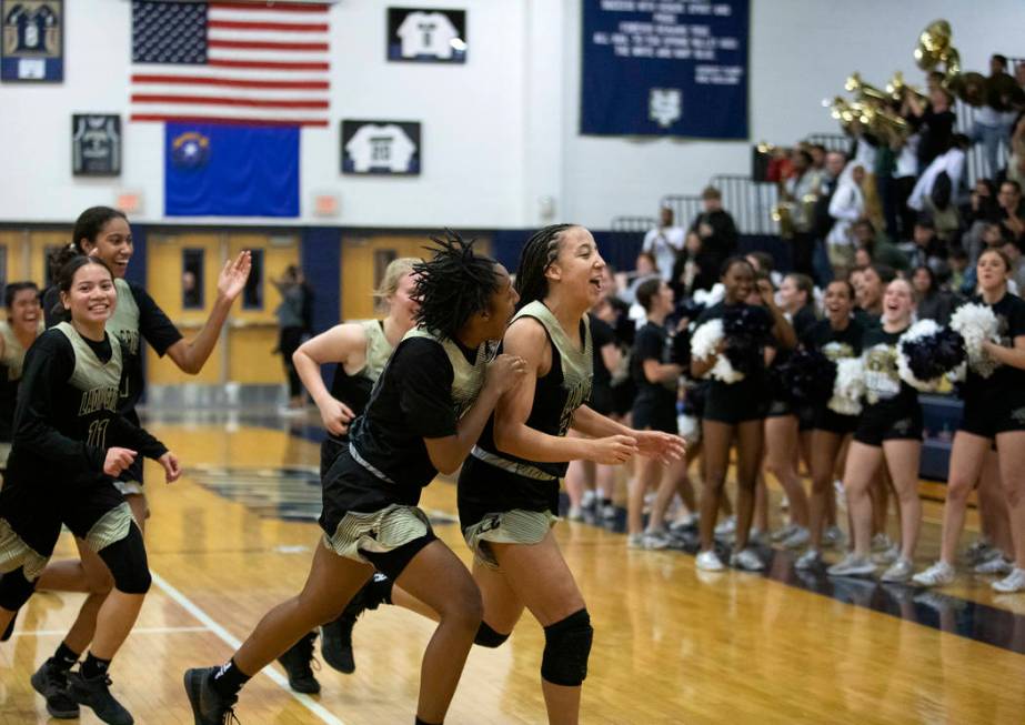 Spring Valley girls basketball runs to the locker room before halftime right after scoring a th ...