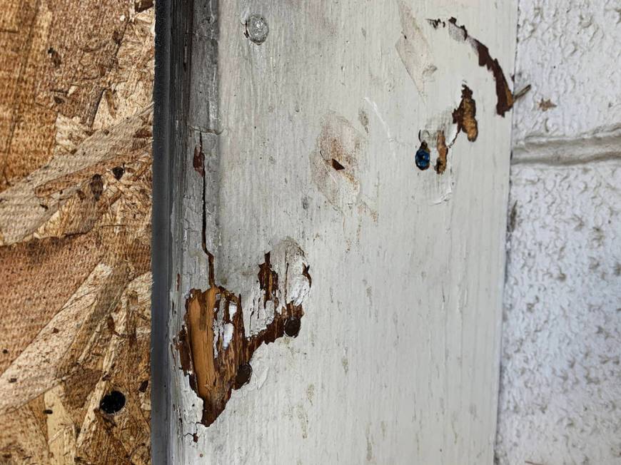Indentations show where the rear door of the Alpine Motel Apartments was bolted shut, pictured ...