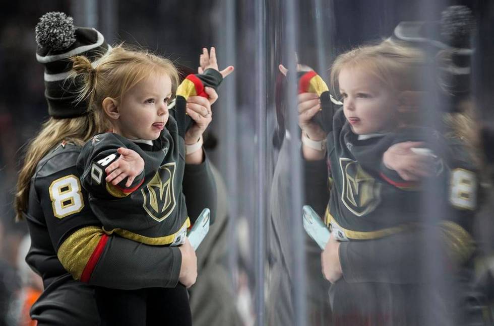 Golden Knights fans cheer for Vegas in the second period of an NHL hockey game against the Phil ...