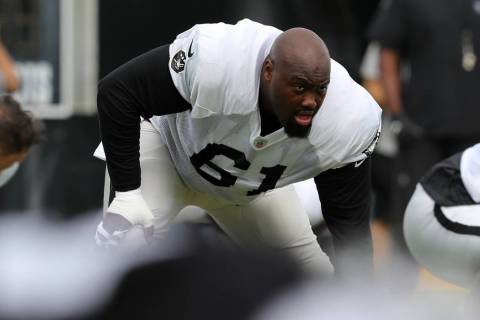 Oakland Raiders center Rodney Hudson (61) stretches during the NFL team's training camp in Napa ...