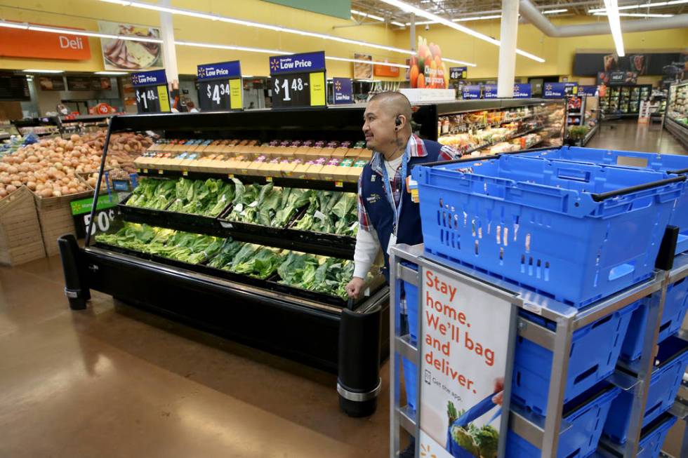 Personal shopper Melvin Oasay fills customer orders for pickup at Walmart at 7200 Arroyo Crossi ...