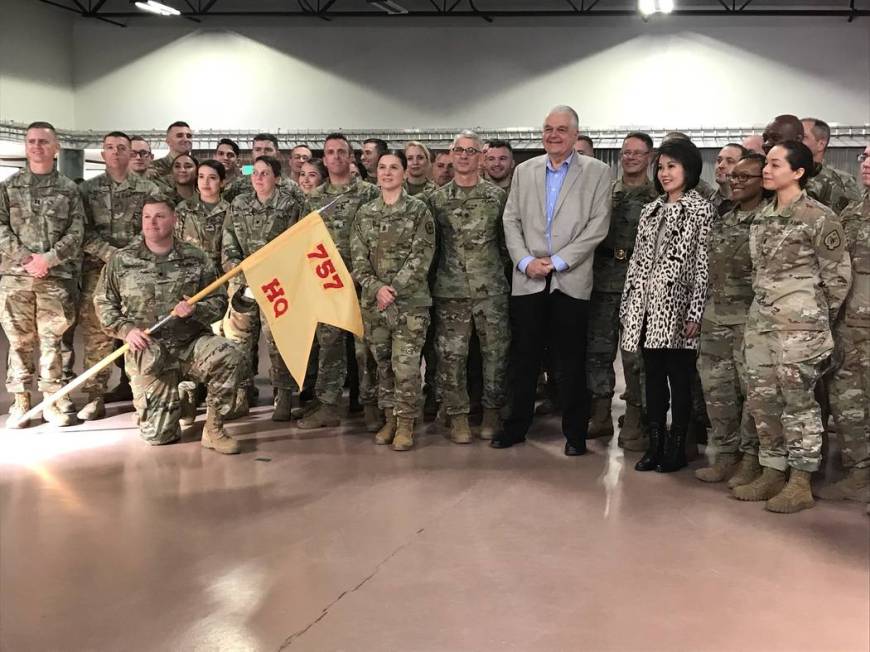 Gov. Steve Sisolak and first lady Kathy Sisolak pose with departing soldiers from the Nevada Ar ...