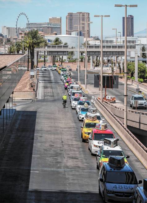 Taxis wait outside Terminal 1 at McCarran International Airport on Thursday, June 28, 2018, in ...