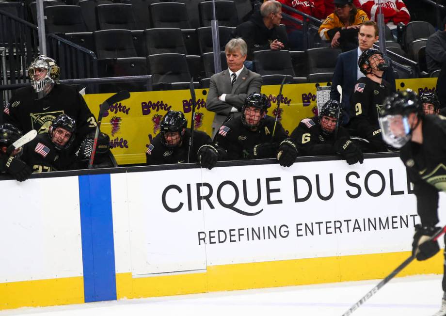 Army Black Knights head coach Brian Riley, centr, watches the action as his team plays Providen ...