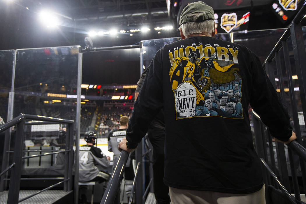 An Army fan watches as the team plays Providence during a Fortress Invitational hockey game at ...