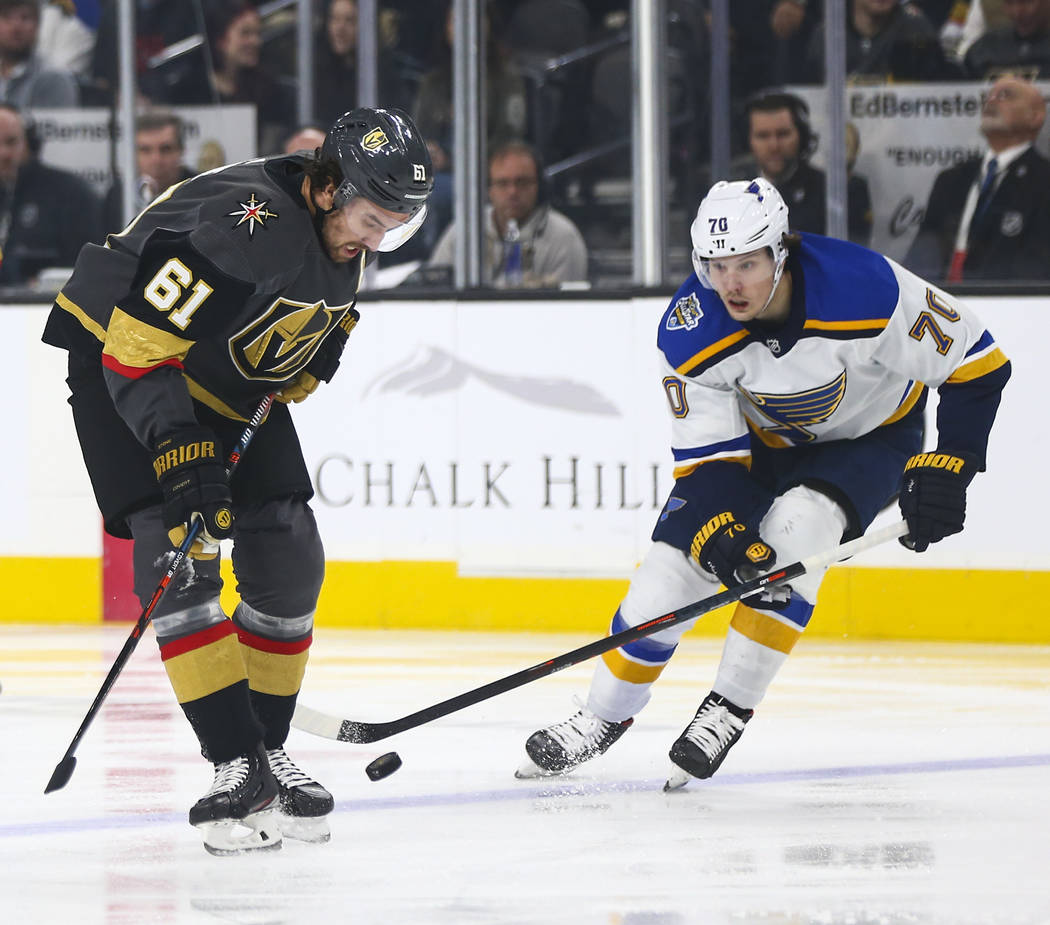 Golden Knights' Mark Stone (61) battles for the puck against St. Louis Blues' Oskar Sundqvist ( ...