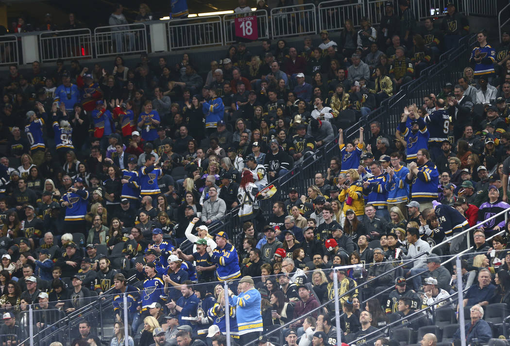 St. Louis Blues fans celebrate their team's first goal against the Golden Knights in the first ...