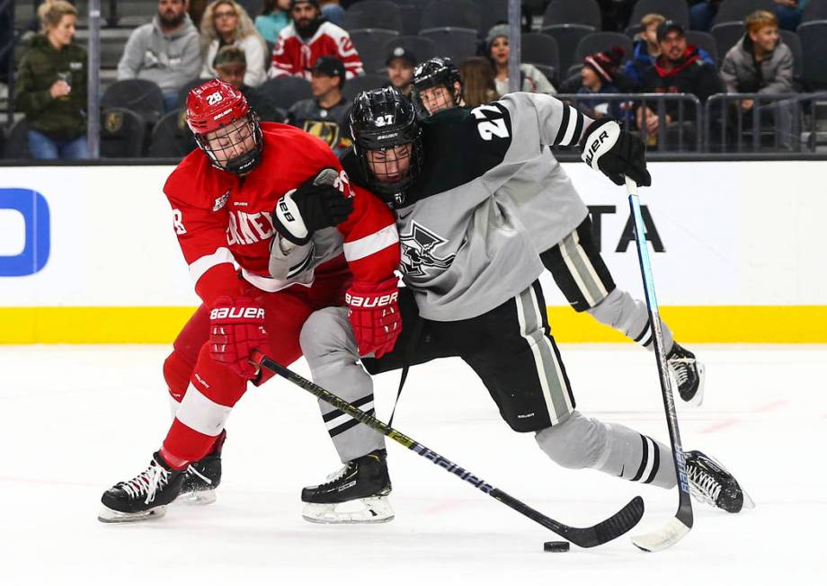 Cornell Big Red's Brenden Locke (28) and Providence Friars' Tyce Thompson (27) battle for the p ...