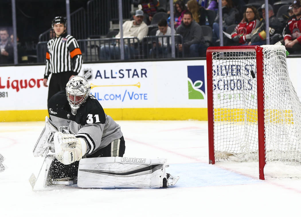 Providence Friars goaltender Hayden Hawkey (31) blocks the puck during the second period of the ...