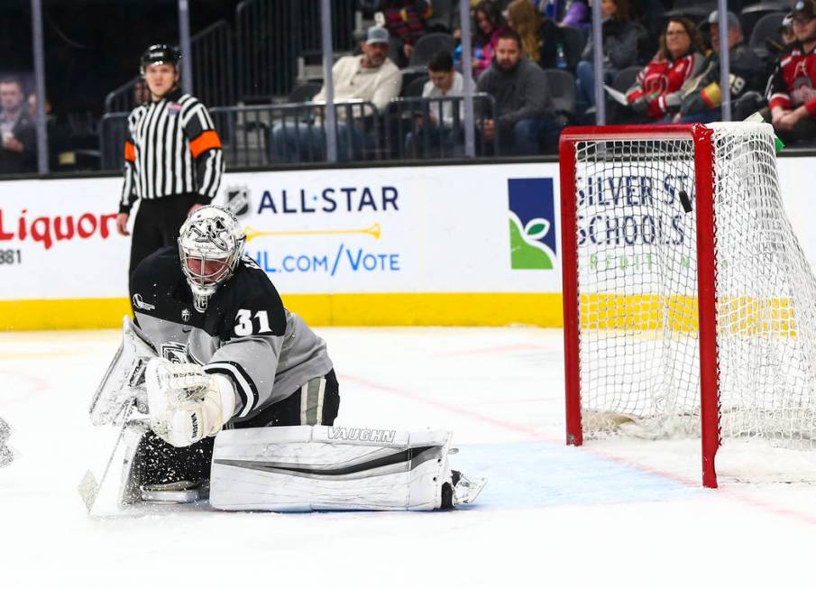 Providence Friars goaltender Hayden Hawkey (31) blocks the puck during the second period of the ...