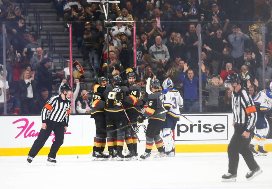 The Golden Knights celebrate a goal by Ryan Reaves during the second period of an NHL hockey ga ...