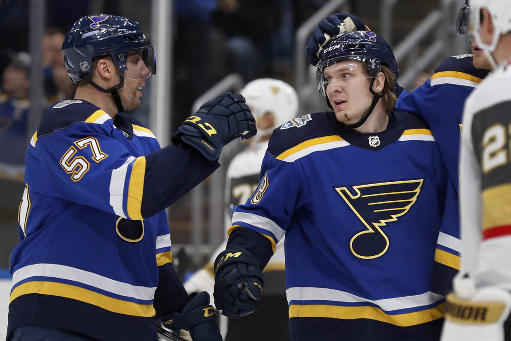 St. Louis Blues' Robert Thomas, right, is congratulated by David Perron (57) after scoring duri ...