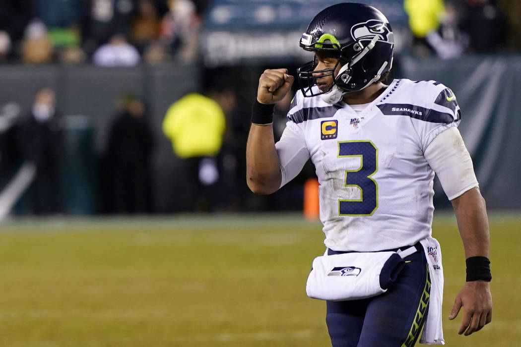 Seattle Seahawks' Russell Wilson reacts during the second half of an NFL wild-card playoff foot ...
