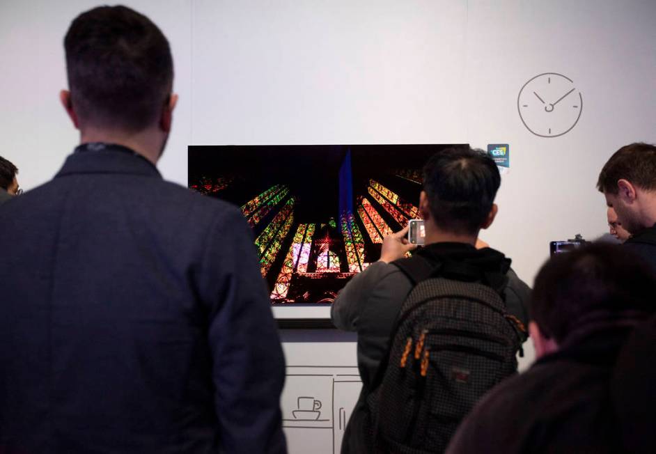 People photograph Samsung's "The Frame" TV at Samsung's CES 2020 First Look event on Sunday, Ja ...