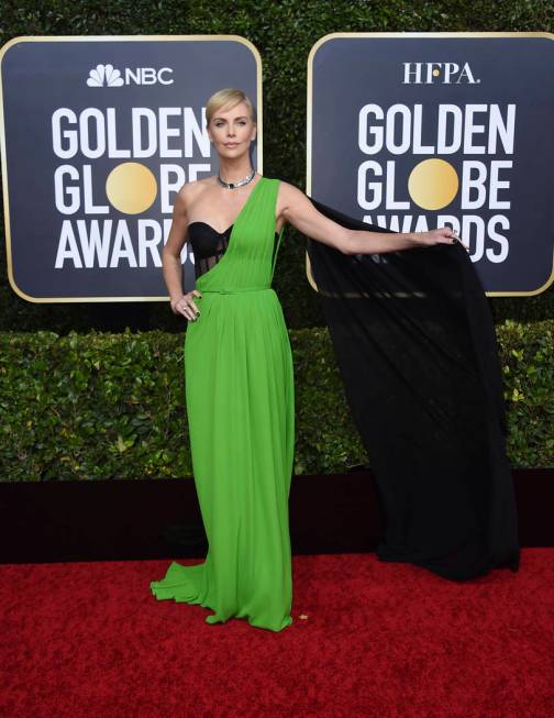 Charlize Theron arrives at the 77th annual Golden Globe Awards at the Beverly Hilton Hotel on S ...