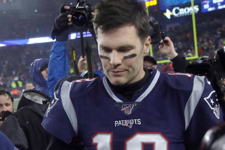 New England Patriots quarterback Tom Brady leaves the field after losing to the Tennessee Titan ...