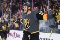 Vegas Golden Knights defenseman Jon Merrill (15) celebrates after scoring a goal in the first p ...