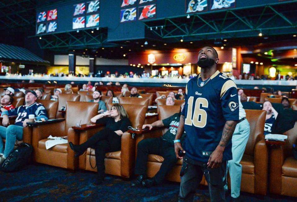 People watch Super Bowl LIII at the Westgate Superbook in Las Vegas in Las Vegas, Sunday, Feb. ...