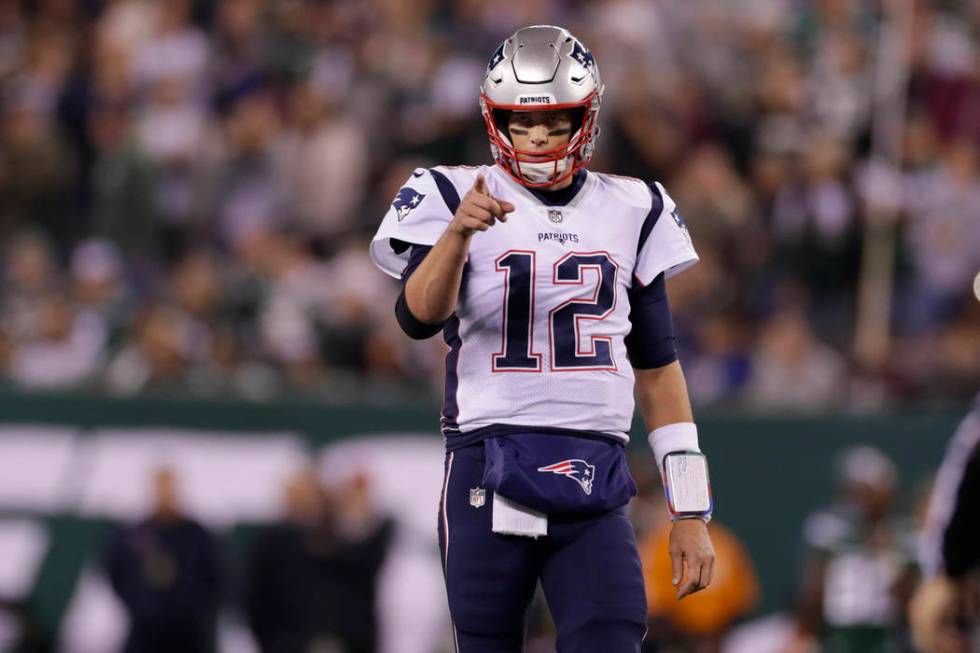 New England Patriots quarterback Tom Brady (12) points to Benjamin Watson (84) after a play dur ...