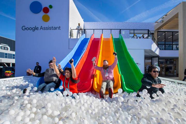 Robert McKenna, center, joins others down into a ball pit outside the Google display center on ...