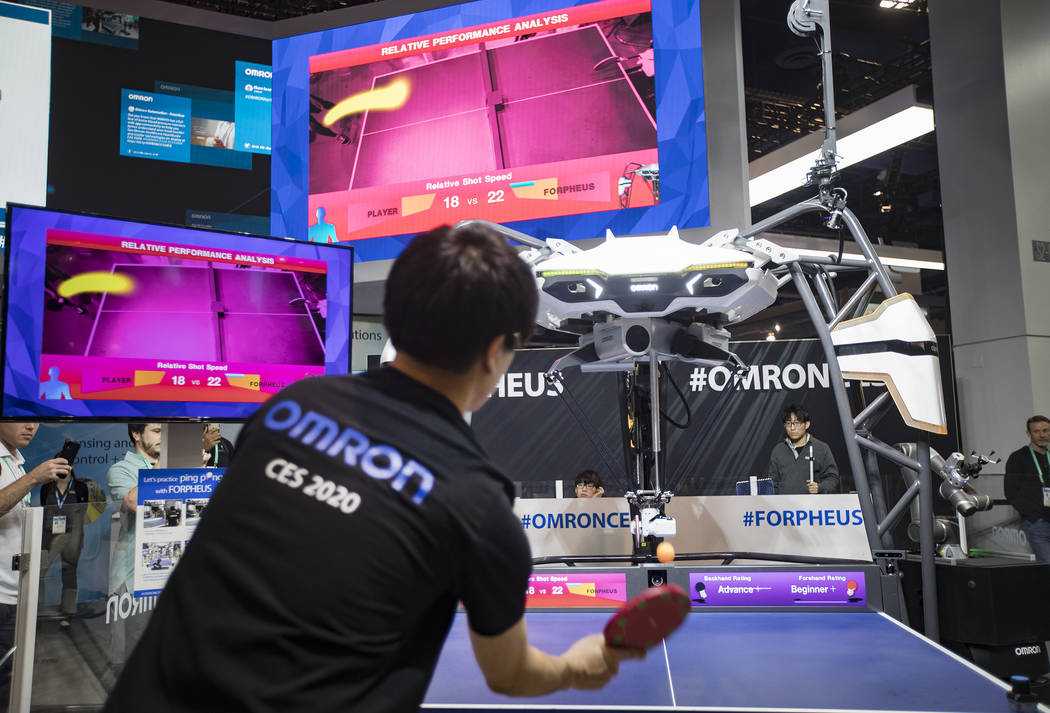 Yuki Sasayi plays ping pong with Forpheus, an AI equipped robotic table tennis tutor created by ...