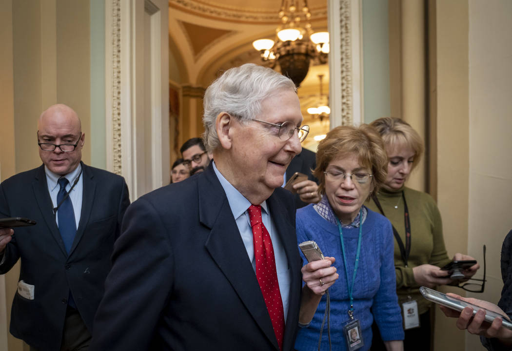 Senate Majority Leader Mitch McConnell, R-Ky., is surrounded by reporters after remarks on the ...