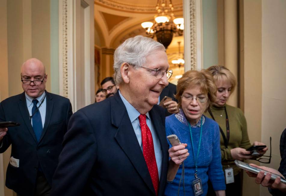 Senate Majority Leader Mitch McConnell, R-Ky., is surrounded by reporters after remarks on the ...