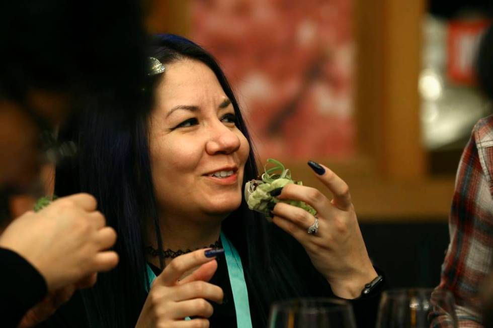 A patron samples a new Impossible Pork dish from Impossible Foods, the California plant-based m ...